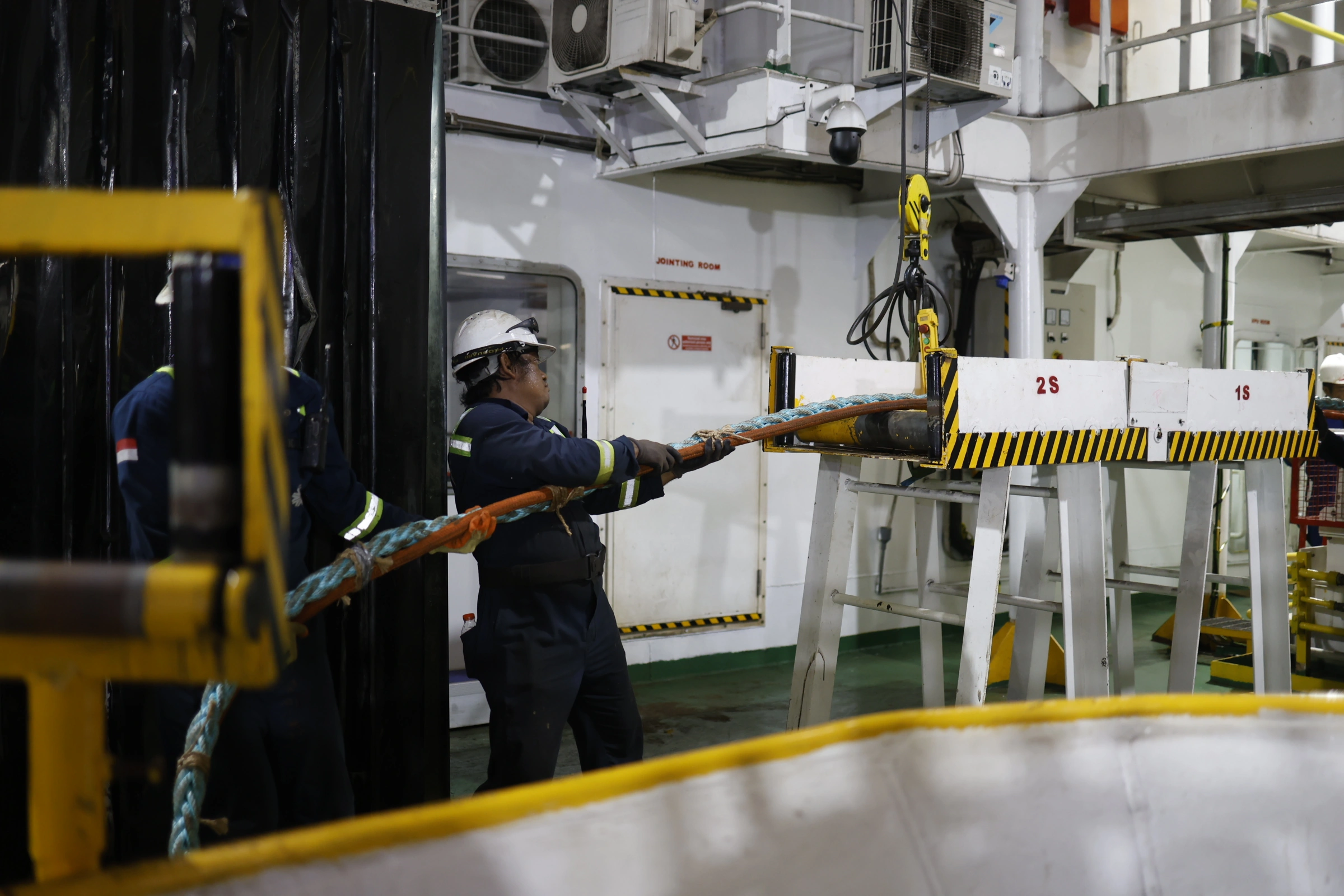 Cable-laying vessel operations with specialized maritime equipment